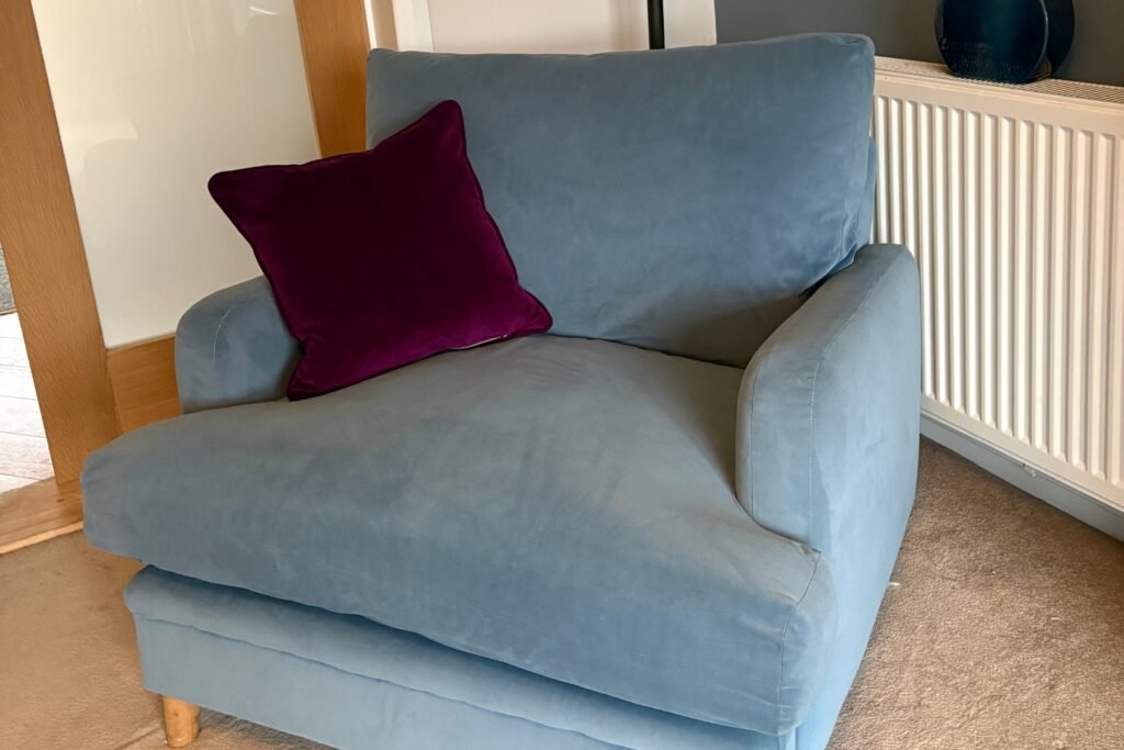 Blue chair in Ashby‑de‑la‑Zouch restored with new custom‑fit cushions after refilling