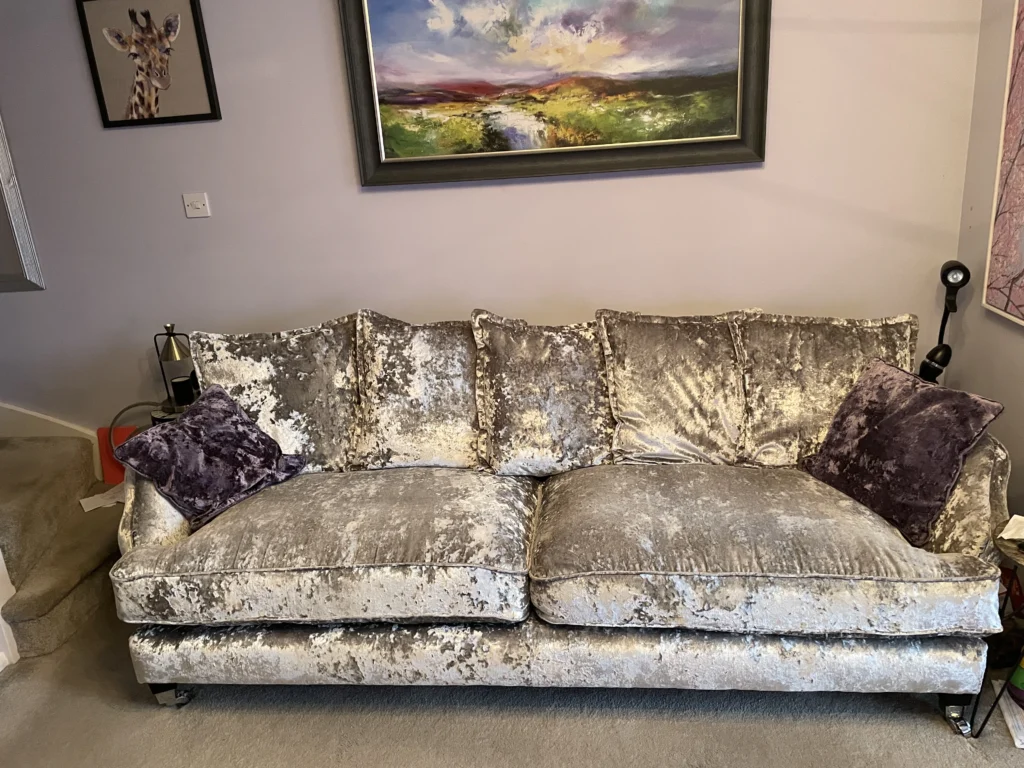 A three seater sofa with new cushion inserted.